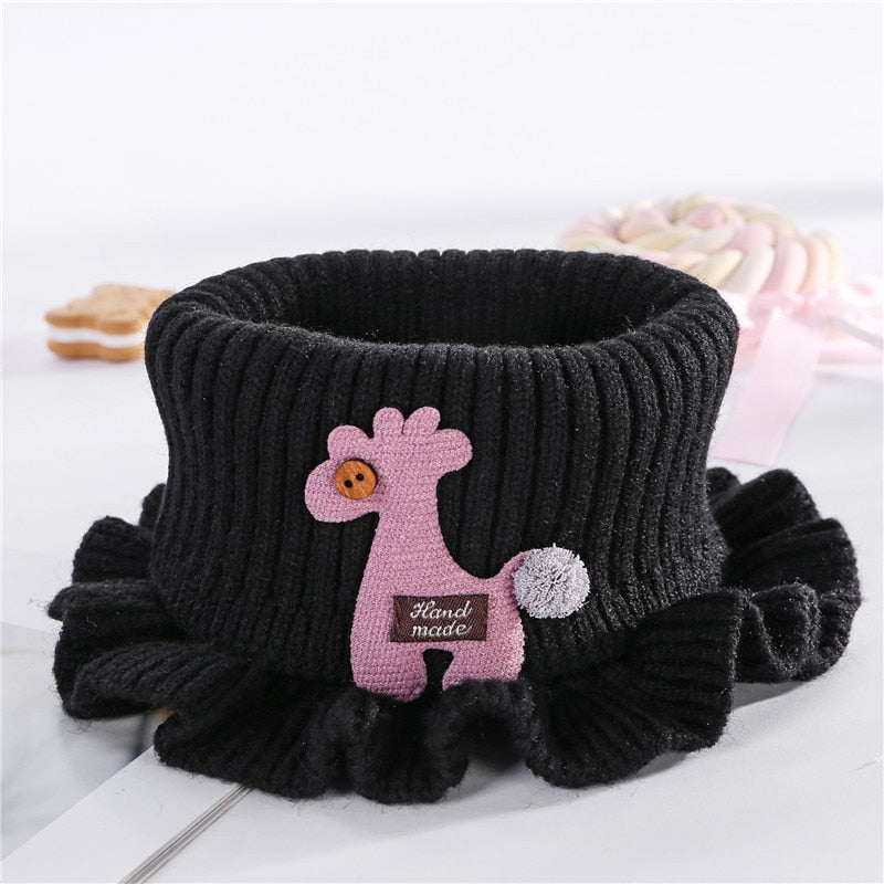 Toddler wearing a cozy knitted neck warmer with elegant lace detail, cute baby accessory