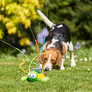 A colorful large flower-shaped sprinkler toy spraying water streams, bringing cool relief for kids and pets in summer.