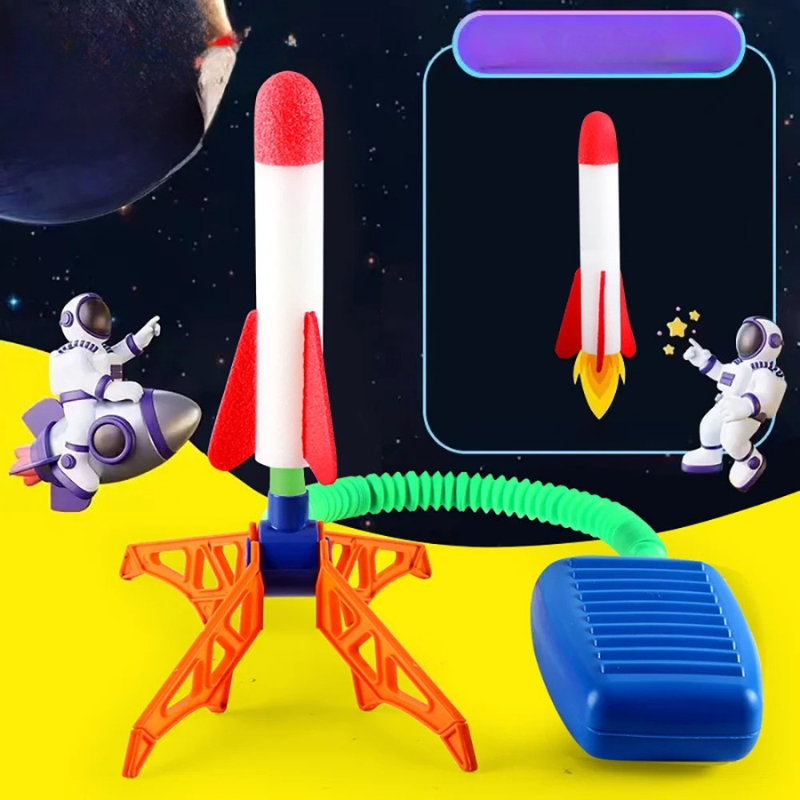 Child happily stomping on the launcher of an outdoor rocket toy, active game