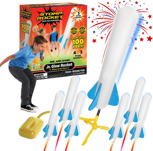 Kids launching a red foam rocket from a green Air Power Rocket Launcher toy set outdoors