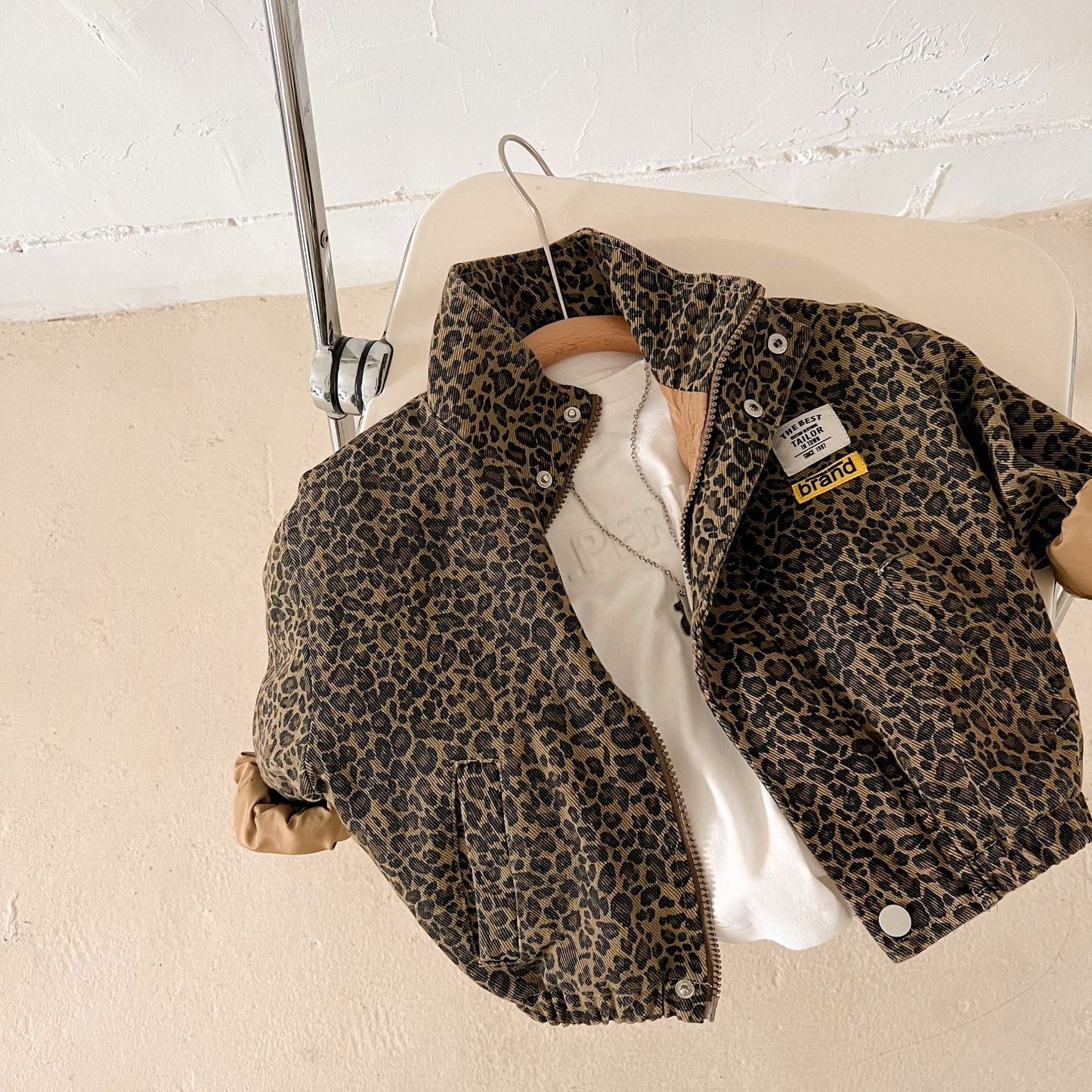 Full shot of kids' leopard print jacket and pant set, perfect for fall and winter