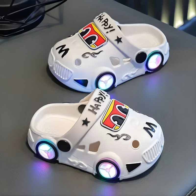 Pair of kids' light-up car slippers, showcasing the cozy interior and durable anti-slip sole