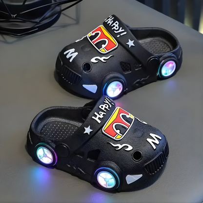 Side view of cheerful kids' car design light-up slippers, ideal for indoor adventures
