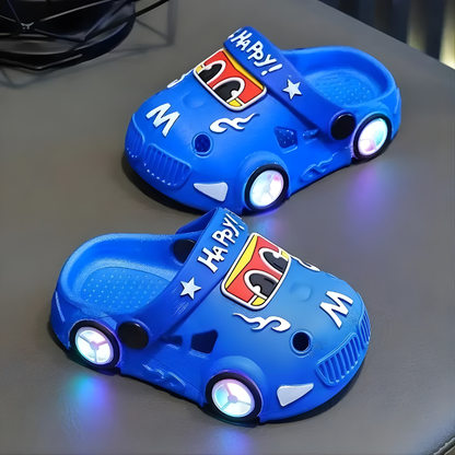 Bright blue kids light-up car slippers with vibrant LED lights, perfect for young boys and girls