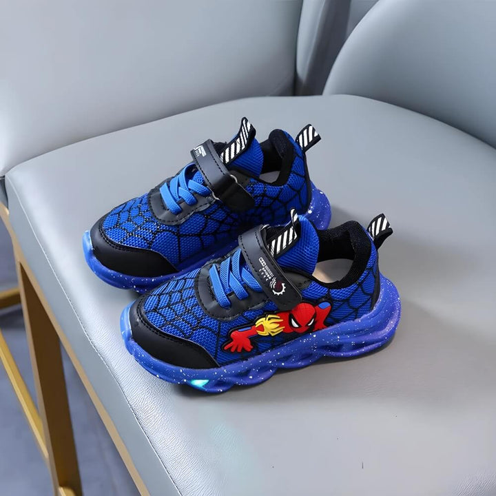 Blue boys' LED light-up sneakers; durable velcro footwear for active kids' fun playtime.