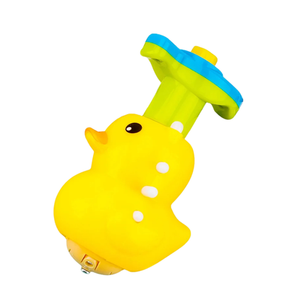 Toddler playing with a bright light-up musical spinning top toy, educational fun