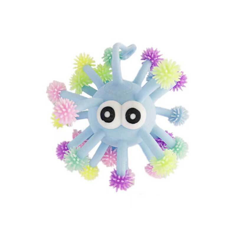 Light-up sensory squeeze ball toy on a play surface, offering bright fun and stress relief for kids