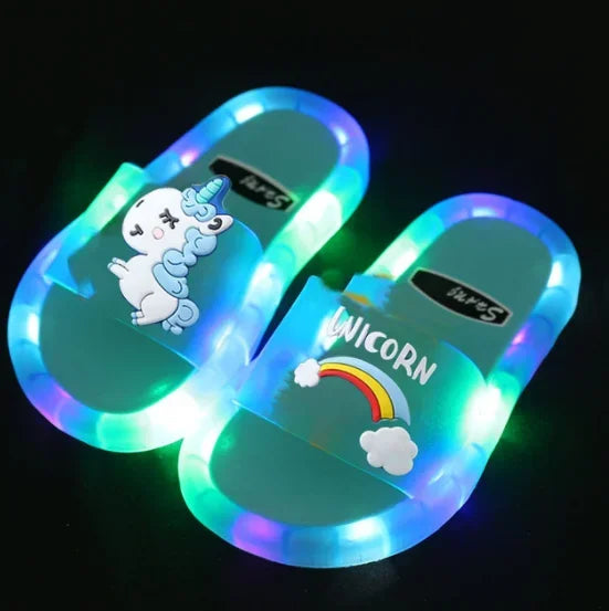 Child wearing pink light-up unicorn slippers, enjoying magical comfort at home