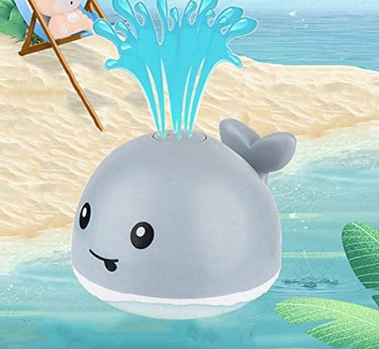 Kids' light-up whale bath toy spraying water, colorful and sensory for toddlers