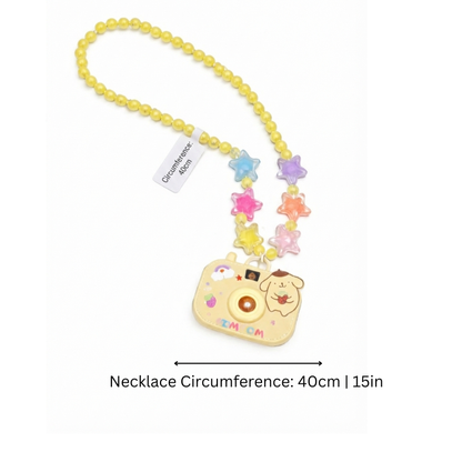 Close-up of Kids' Magical Camera Projector Necklace, showing lens and buttons, children's accessory