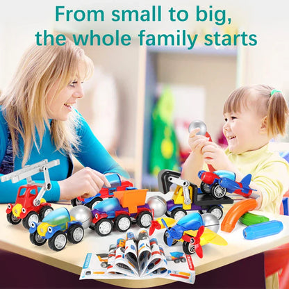 Toddler playing with magnetic building vehicle toy set, constructing a yellow excavator, STEM fun