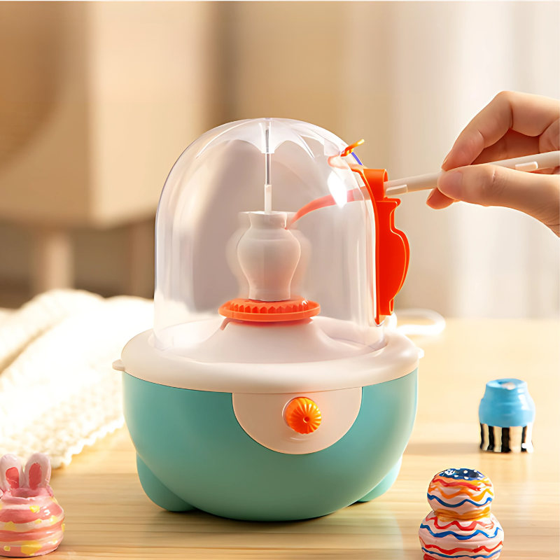 Kids' mini pottery wheel kit with colorful clay and tools for creative art play, enhancing motor skills