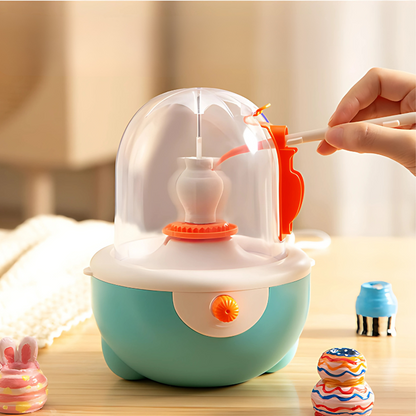 Kids' mini pottery wheel kit with colorful clay and tools for creative art play, enhancing motor skills