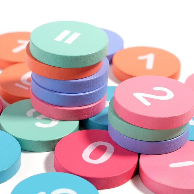 Toddler engaged with a Montessori math set, developing cognitive skills & enjoying a learning game.