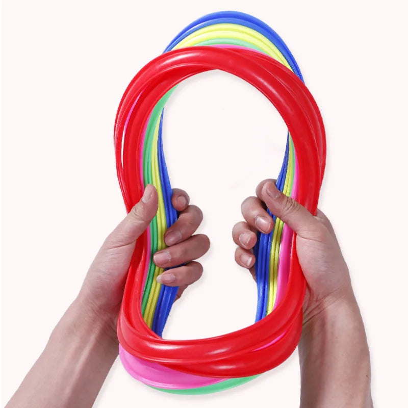 A complete kids' outdoor agility hoops set laid out on grass, perfect for fun physical activity.