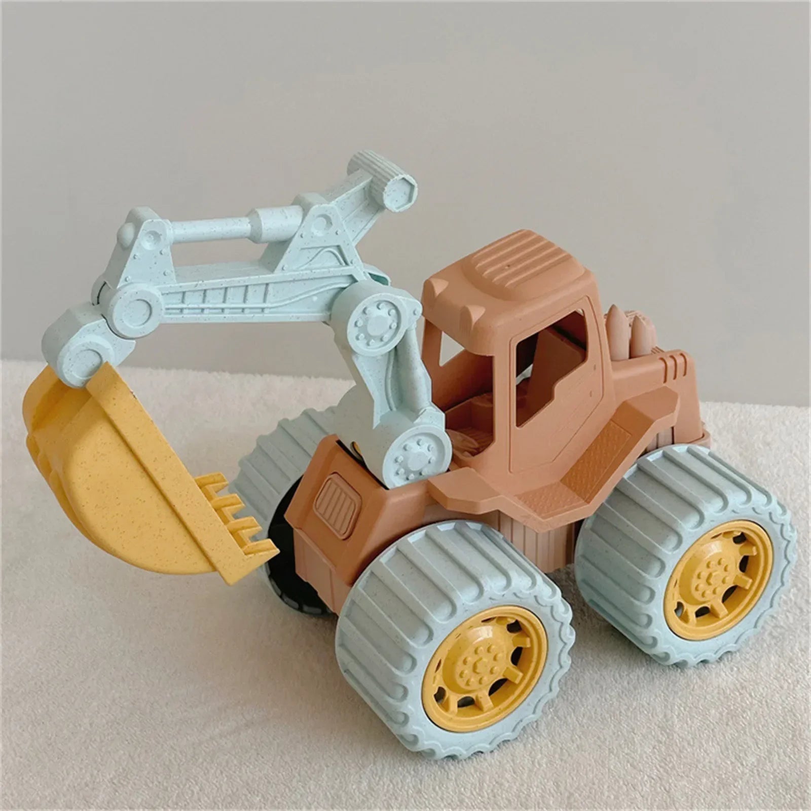 Kids outdoor construction vehicle play set with yellow excavator, bulldozer, and dump truck on sand.