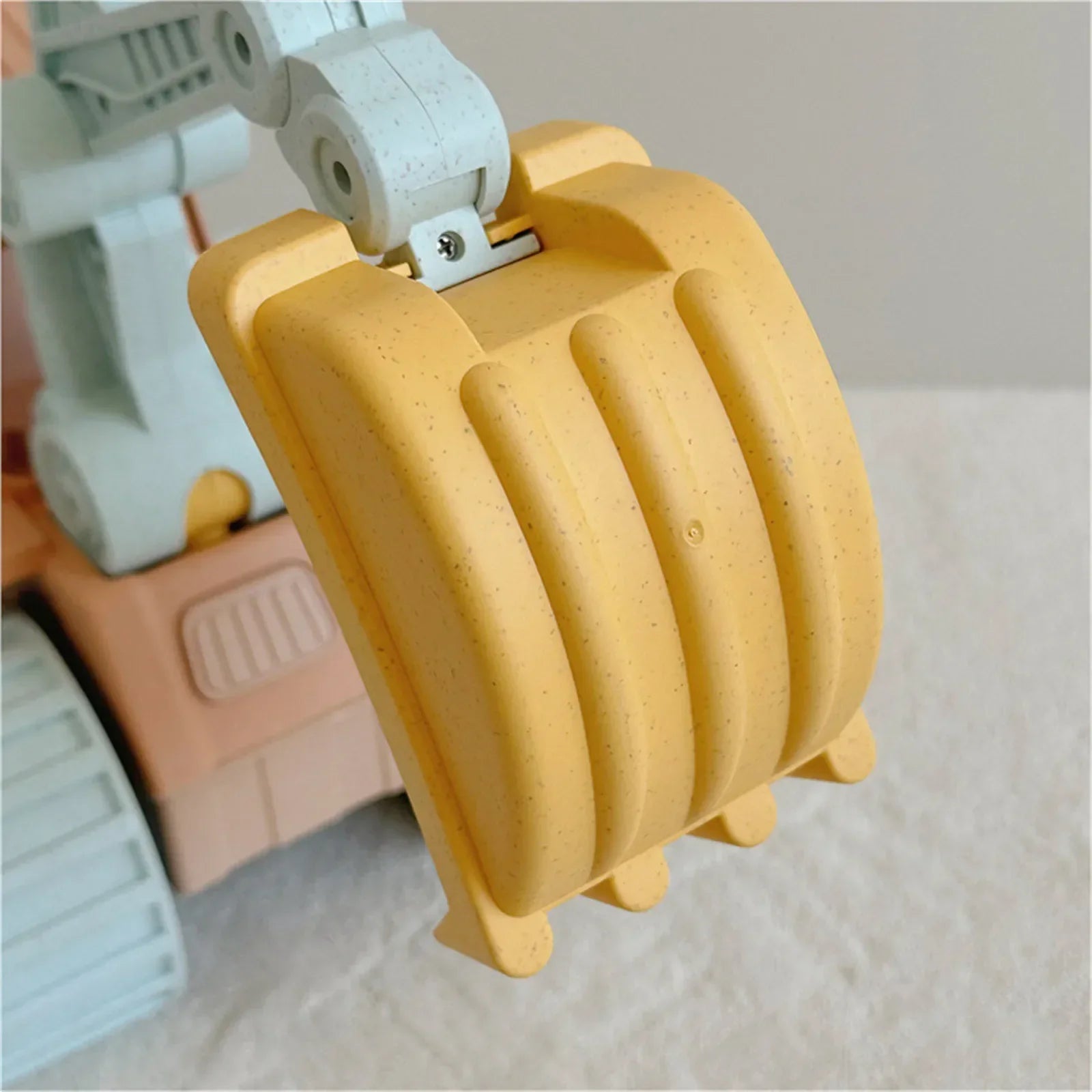 Children's bulldozer toy, part of an outdoor construction vehicle set, perfect for imaginative play.