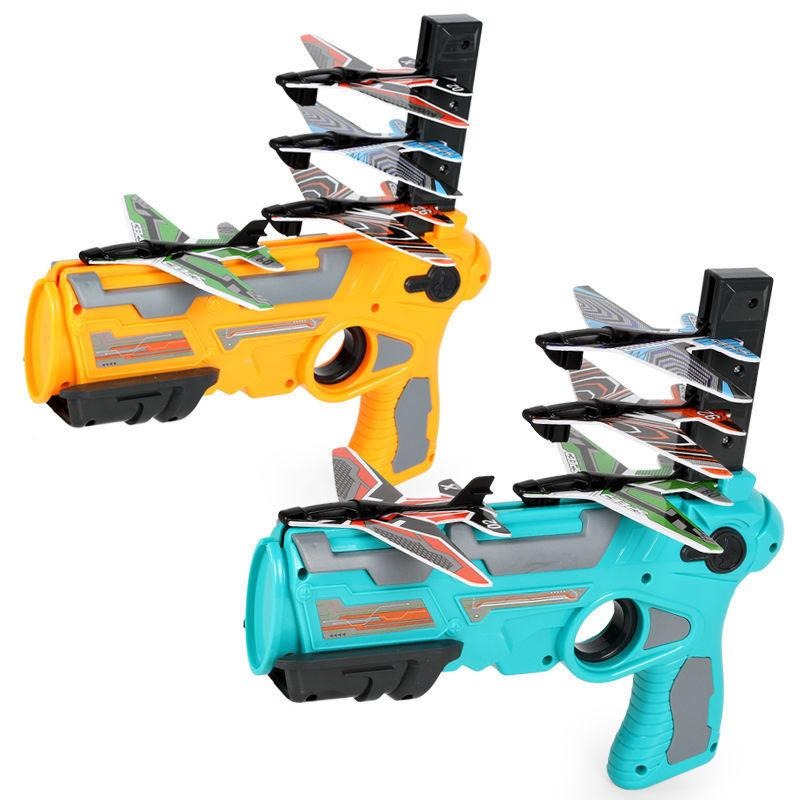 Kids' outdoor foam airplane launcher toy set with three colorful planes, perfect for family play