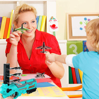 Three foam airplanes, red, yellow, and blue, ready to be launched with the Kids' Foam Airplane Launcher