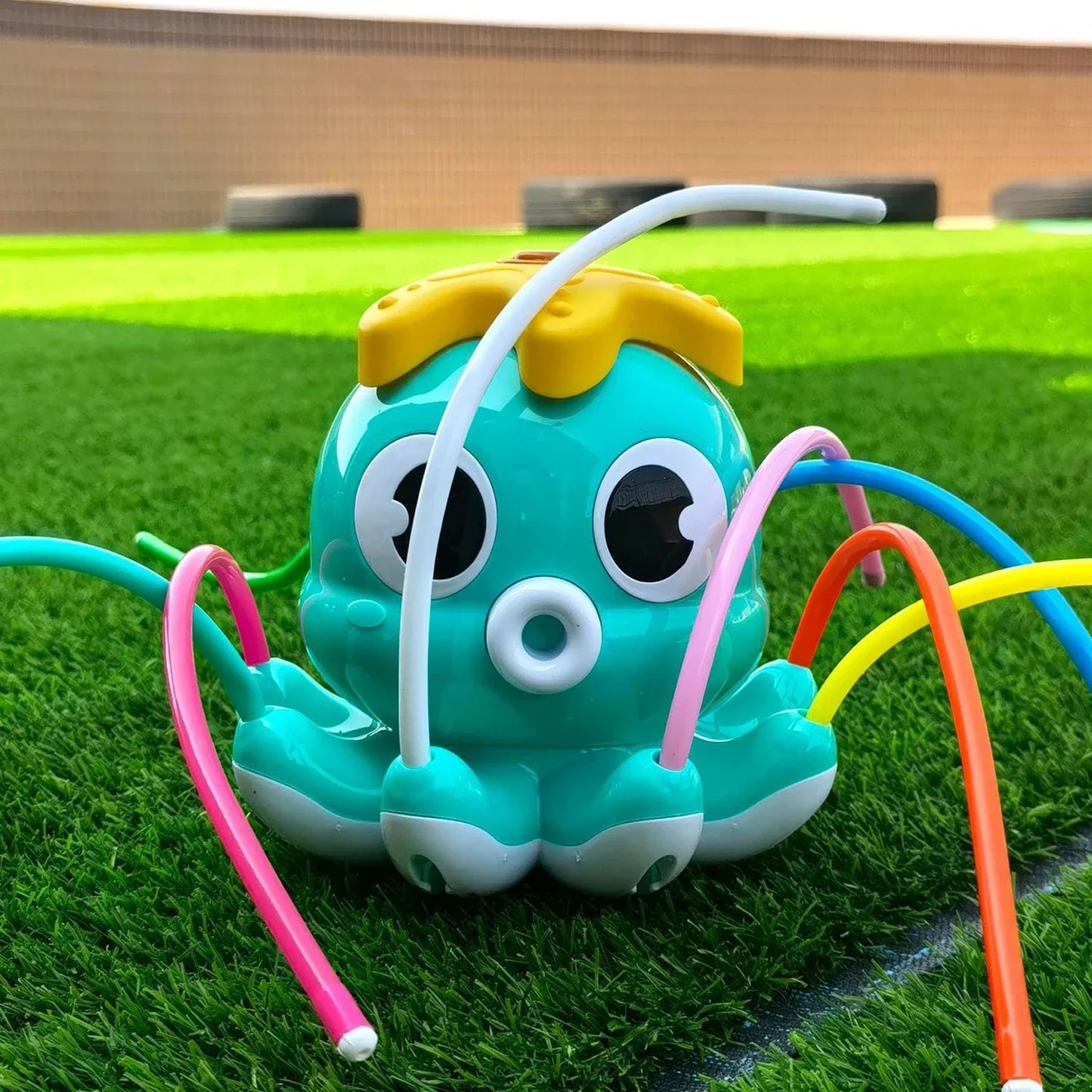 Octopus water sprinkler with multiple spraying arms, great for kids' outdoor activity
