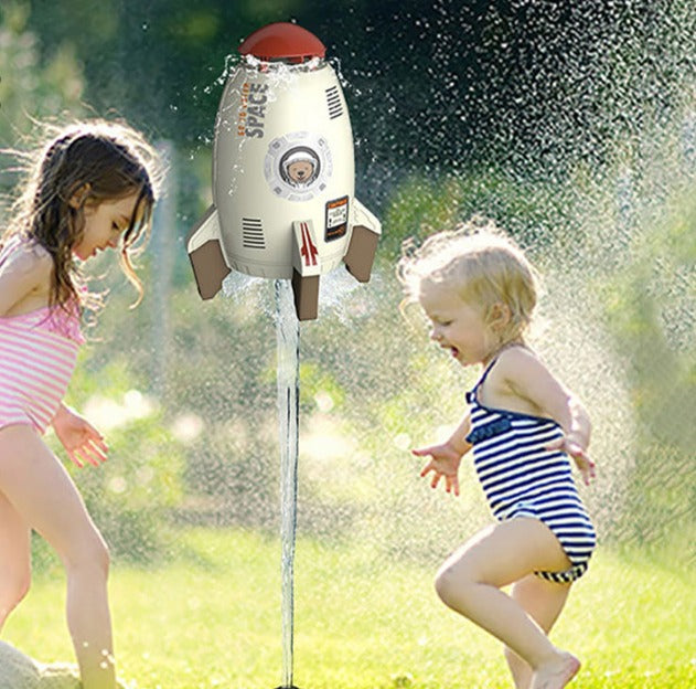 Kids' Outdoor Water Rocket Sprinkler Toy, 3 feet tall, red and blue, spraying water for summer fun