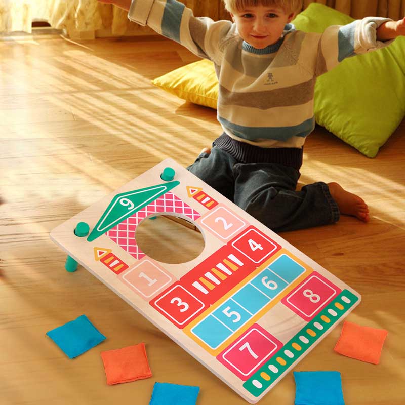 Kids' outdoor wooden toss game set with colorful sandbags, promoting skill development for ages 3+.