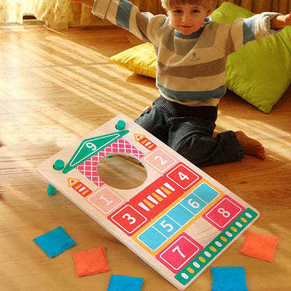 Kids' outdoor wooden toss game set with colorful sandbags, promoting skill development for ages 3+.