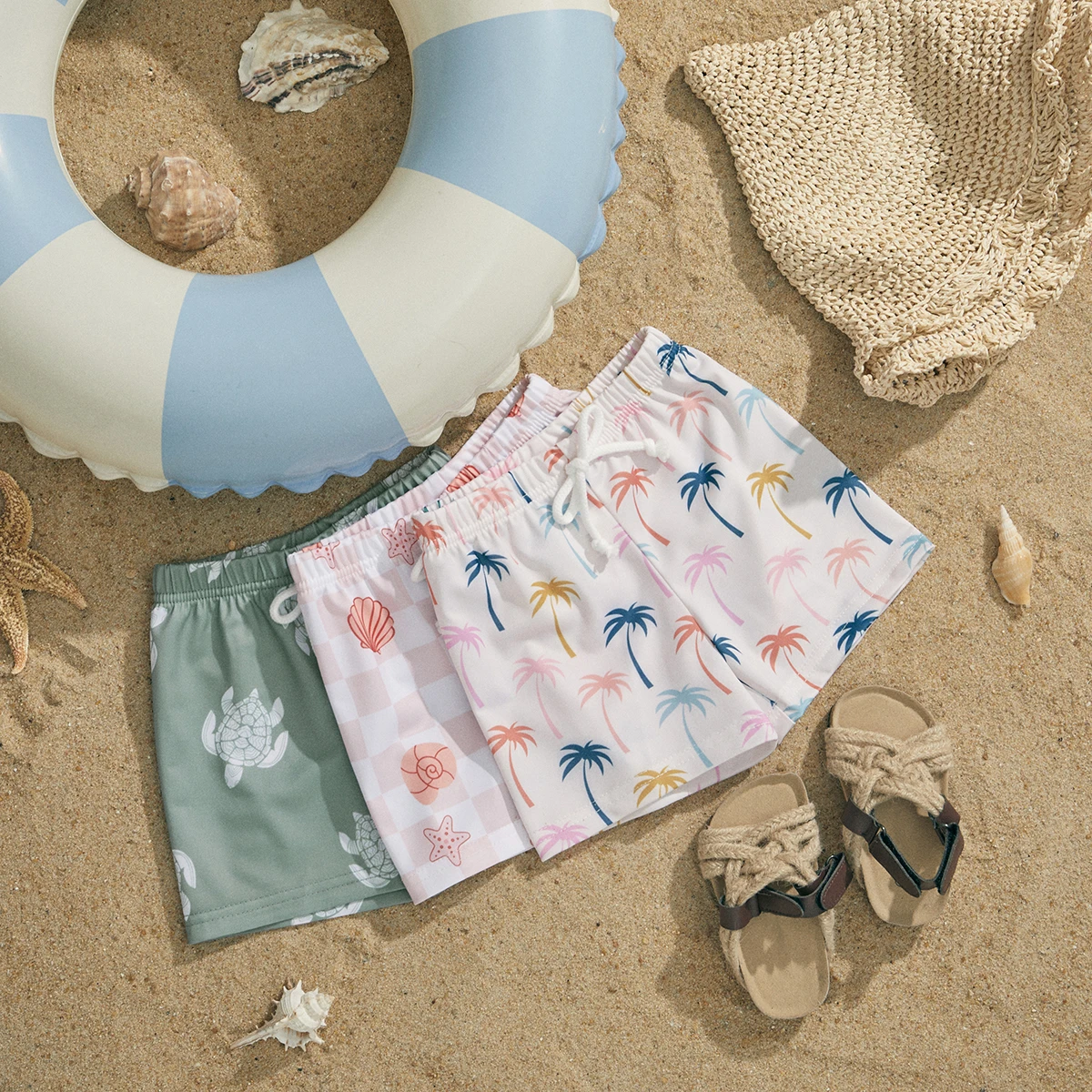 Close-up of vibrant pattern on kids' summer swim trunks, perfect for toddler and baby swim.