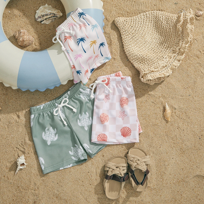 Pair of kids' patterned swim trunks, elastic waist, suitable for boys and girls swimwear.