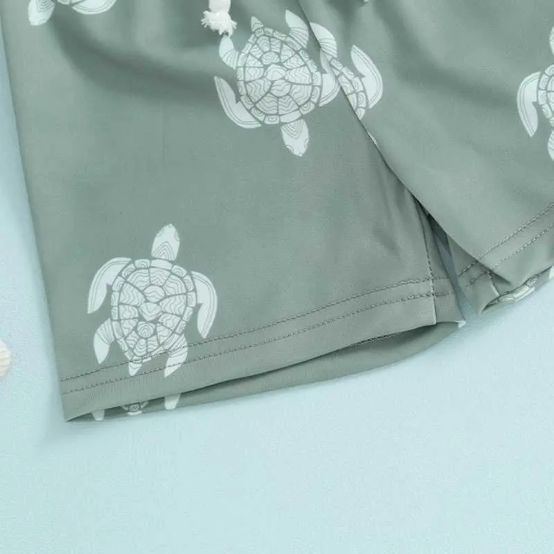 Summer swim trunks for kids with abstract pattern, comfortable polyester for beach days.