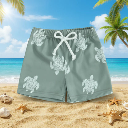 Flat lay of lightweight kids' swim trunks, summer pattern, essential baby beach clothing.