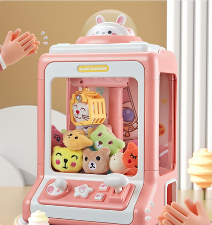 Kids' pink mini claw machine toy with lights, sounds, and joystick for arcade fun