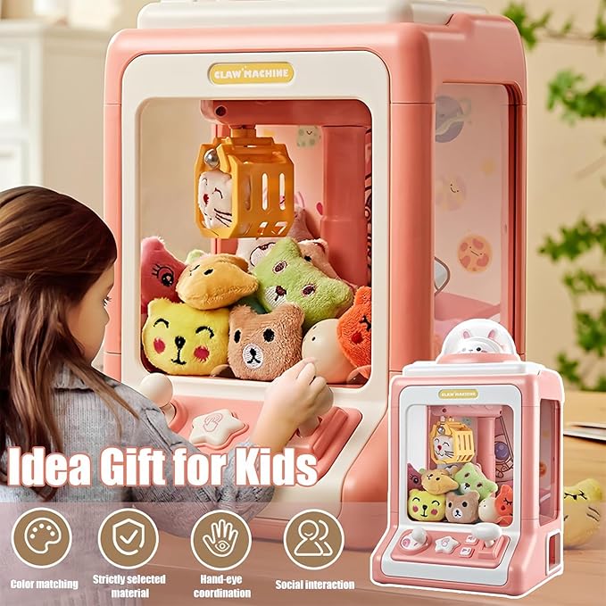 Close-up of kids' arcade claw machine toy with prize chute and colorful plastic coins