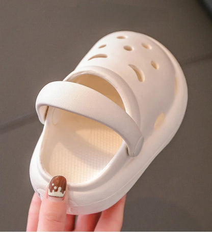 Close-up of the breathable holes on kids indoor play clogs, comfort