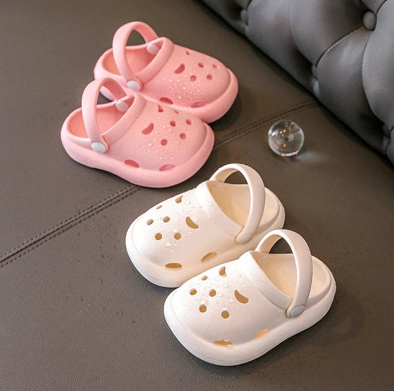 Childrens non-slip beach & indoor clogs, displayed on a wooden floor