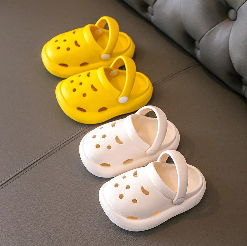 A single green kids non-slip clog, showcasing texture and form