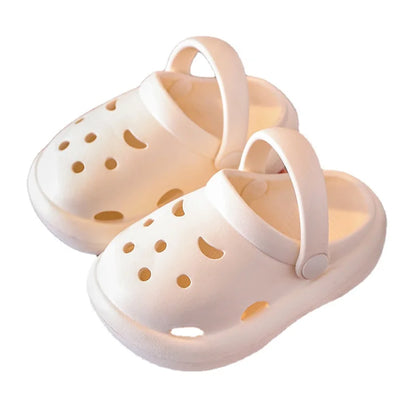 Pair of green kids non-slip beach & indoor play clogs, top down view