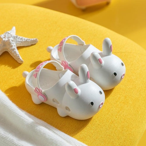 Close-up of lightweight children's clogs with cute rabbit face design, summer shoes