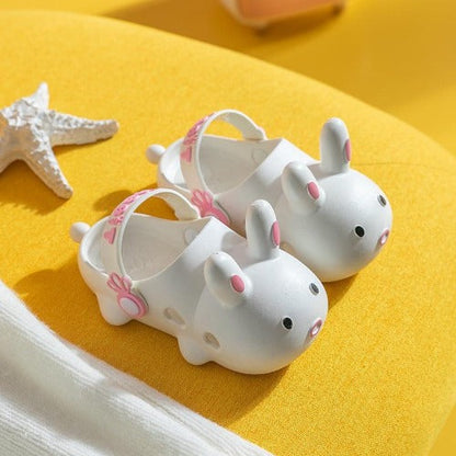 Close-up of lightweight children's clogs with cute rabbit face design, summer shoes