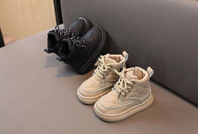 Front view of kids plaid snow boots, showcasing the practical lace-up closure, warm winter apparel