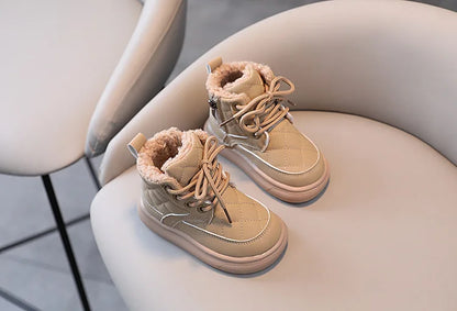 Plaid winter boots for active children, ensuring warmth and grip during playful snowy outings, durable shoes