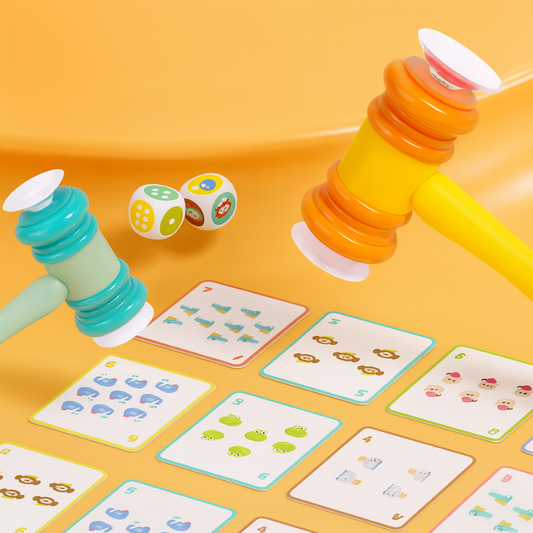 Kids playing educational math game with dice and toy hammers, developing number skills