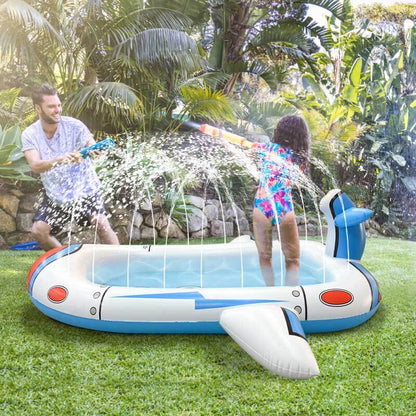 Overhead view of a circular inflatable sprinkler pool for kids showing water jets and colorful marine animal designs.