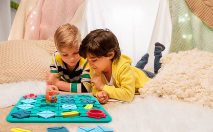 Top-down view of the Logical Road Builder game board with multiple vehicles following a completed road, a fun learning toy
