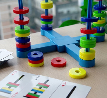 Close-up of a child interacting with magnetic pieces on the Physics Exploration Board Game board