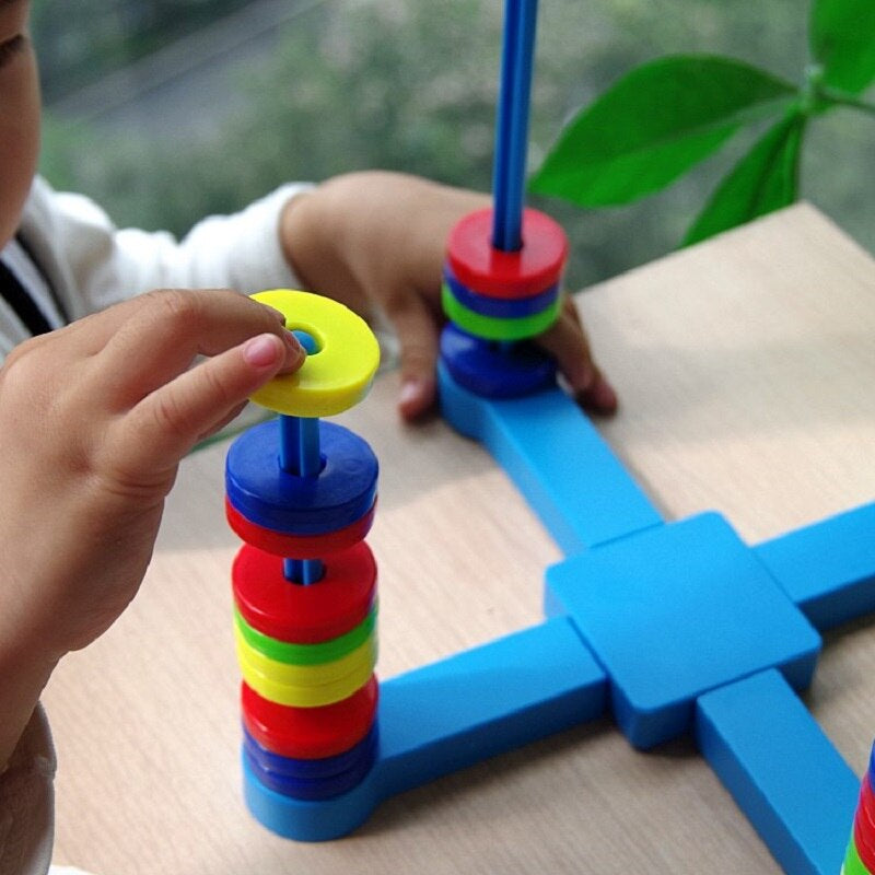 Family playing the educational Magnetic Science & Physics Board Game, learning STEM concepts