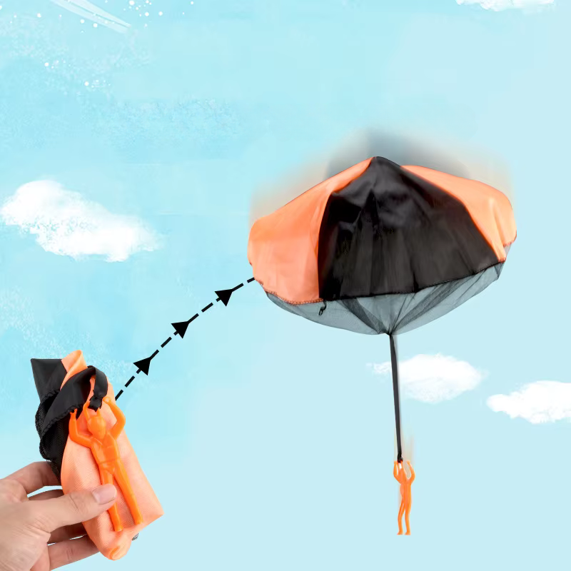 Kids playing outdoors with a colorful tangle-free parachute toy for summer fun