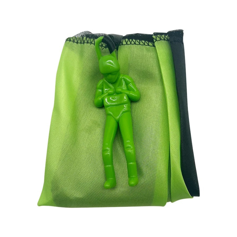 Unisex kids parachute toy laid out on green grass, ready for outdoor play