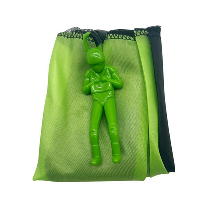 Unisex kids parachute toy laid out on green grass, ready for outdoor play