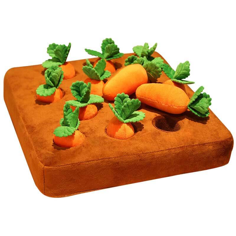 A child happily extracting a soft plush carrot from its snug home, engaging in imaginative harvest play